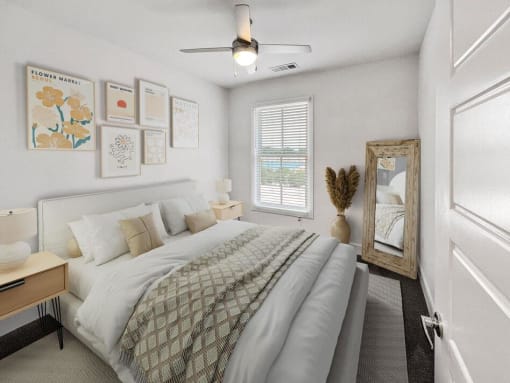 a bedroom with a bed and a ceiling fan at The Merchant Apartments, Charleston, South Carolina