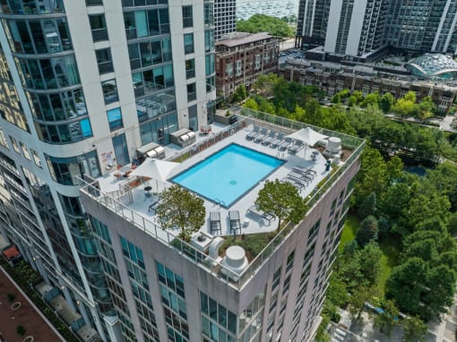 an aerial view of a pool on top of a tall building at Shoreham and Tides, Chicago, IL