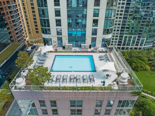 an aerial view of a pool on the roof of a building at Shoreham and Tides Apartments, Chicago, IL
