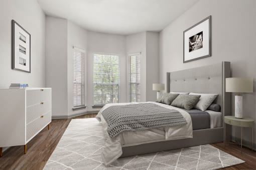 a bedroom with a bed and windows at Aston at Cinco Ranch, Katy, TX