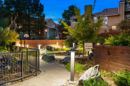 a pathway in front of a house with a landscaped yard at Arcadia Apartments, Centennial, CO 80112