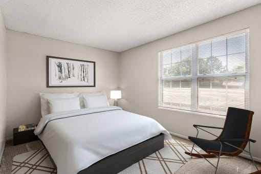 a bedroom with a large bed and a window at Arcadia Apartments, Centennial, CO 80112