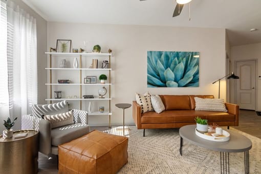 a living room filled with furniture and a painting of a succulent at Element Deer Valley, Arizona, 85027
