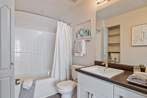 a bathroom with a sink toilet and a shower at Element Deer Valley, Phoenix, 85027
