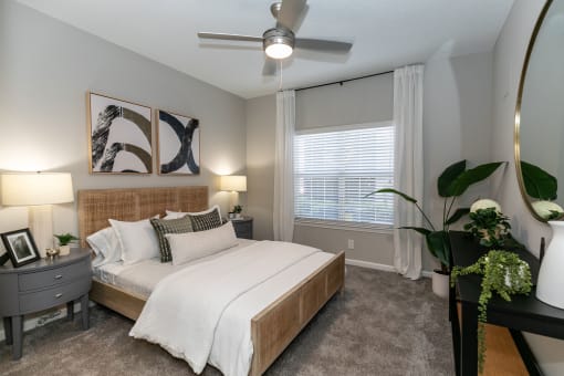 a bedroom with a large bed and a ceiling fan at Willowest in Lindbergh, Georgia