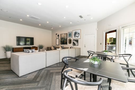 a living room with a table and chairs and a couch at Roswell Village, Roswell, GA