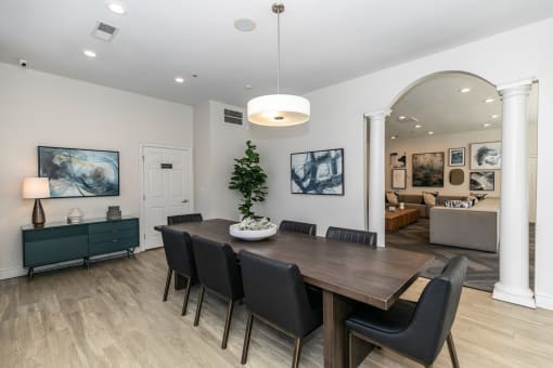 a dining room with a wooden table and black chairs at Roswell Village, Georgia, 30075