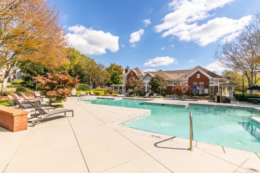 commons pool and resort style buildings with a swimming pool at Roswell Village, Roswell, GA, 30075