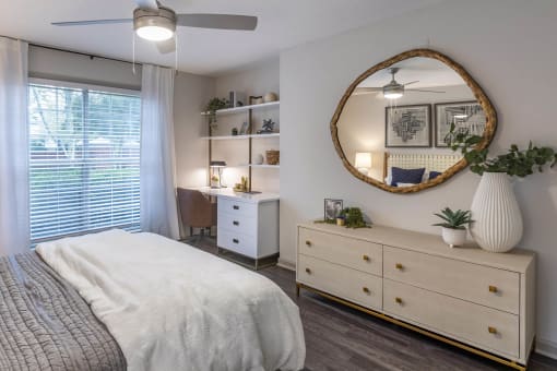 a bedroom with a bed and a mirror at Roswell Village, Roswell, Georgia