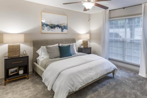 a bedroom with a bed and a ceiling fan at Roswell Village, Roswell, GA