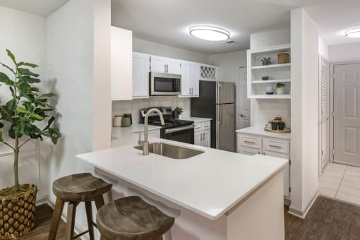 a kitchen with a white counter top and a sink at Roswell Village, Georgia, 30075