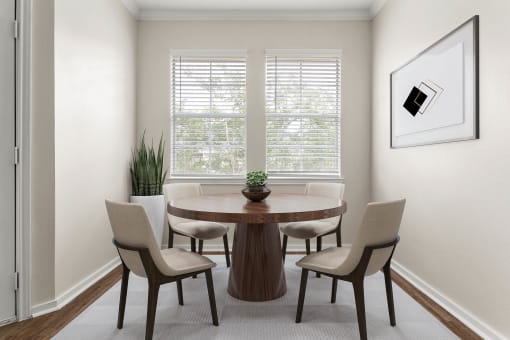 a dining room with a table and chairs and a window at Villages of Cypress Creek, Houston, 77070