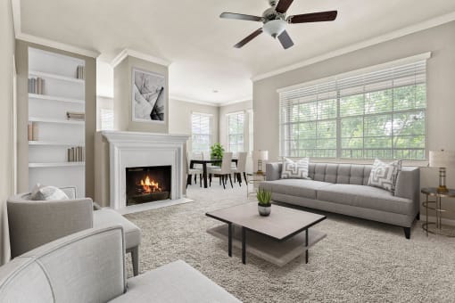 a living room with couches and chairs and a fireplace at Villages of Cypress Creek, Texas