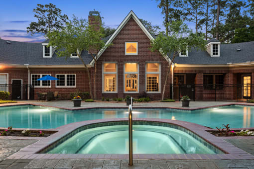 a house with a swimming pool in front of it at Villages of Cypress Creek, Houston, Texas