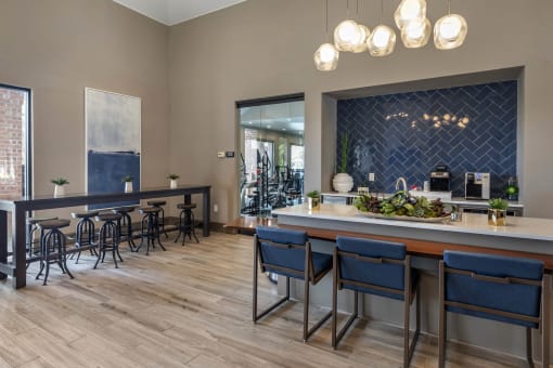 a bar area with bar stools and a counter with chairs at Lakeshore at Preston, Plano, TX, 75093