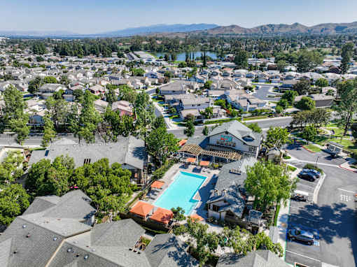 A residential area with houses and a swimming pool.