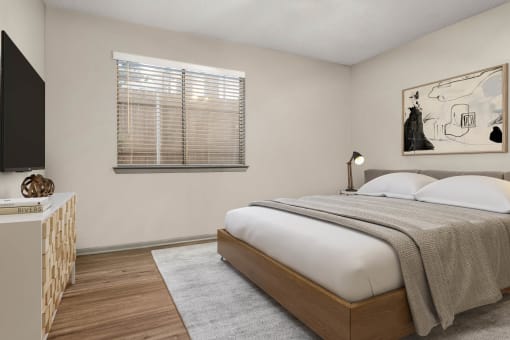 a bedroom with a bed and a window at South Lamar Village, Austin, 78704