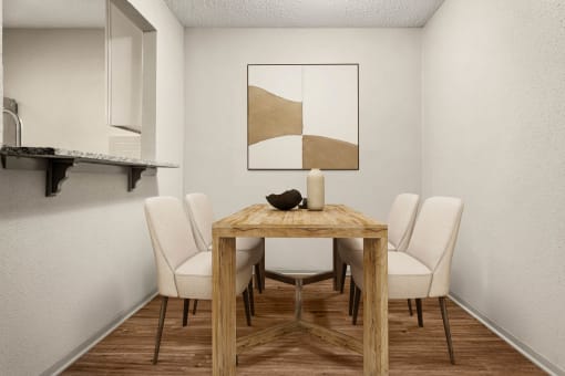 a dining room with a wooden table and white chairs at South Lamar Village, Austin