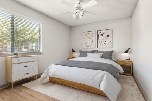 a bedroom with a bed and a ceiling fan at South Lamar Village, Texas, 78704