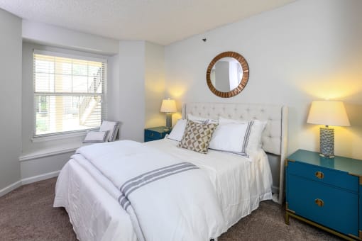 a bedroom with a white bed and a window at Verdant, Boulder