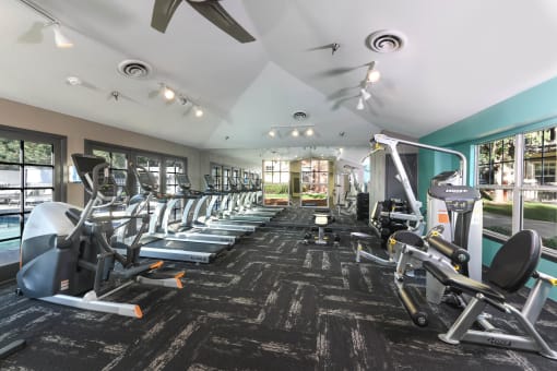 the gym is equipped with cardio equipment and weights at Verdant, Boulder, 80303
