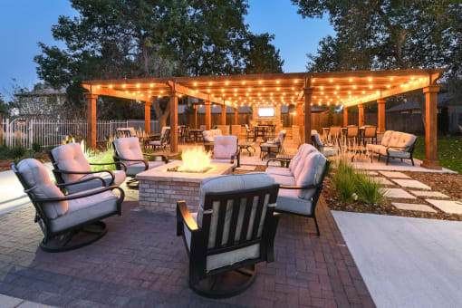 a patio with chairs and a fire pit at Verdant, Boulder, 80303