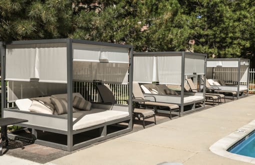a row of lounge chairs next to a swimming pool at Verdant, Boulder, Colorado