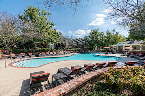 Resort style swimming pool with lounge chairs at Wyndchase Aspen Grove Apartments, Tennessee