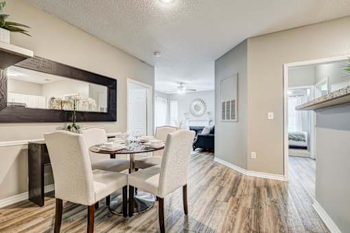 Dining area with modern furnishings and hallway at Wyndchase Aspen Grove Apartments, Franklin, TN 37067