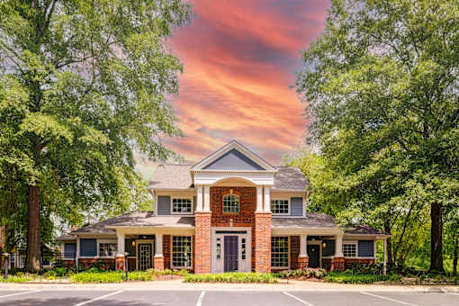 Two story brick clubhouse with columned entrance at Wyndchase Aspen Grove Apartments, Franklin, Tennessee