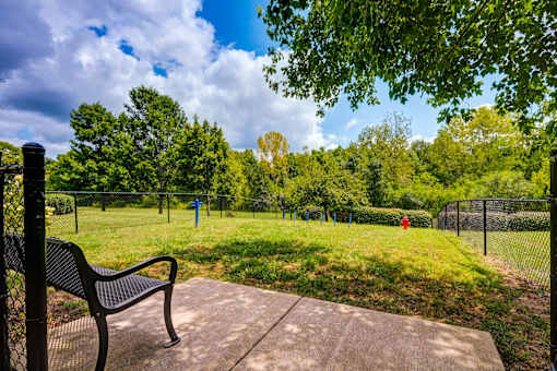 Fenced dog park with bench and exercise equipment at Wyndchase Aspen Grove Apartments, Tennessee