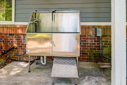 Stainless steel dog wash station with ramp at Wyndchase Aspen Grove Apartments, Franklin, TN