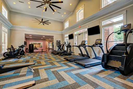 Fitness center with cardio equipment and treadmills at Wyndchase Aspen Grove Apartments, Tennessee