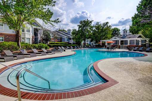 Luxury pool with curved steps and sundeck at Wyndchase Aspen Grove Apartments, Franklin, TN 37067