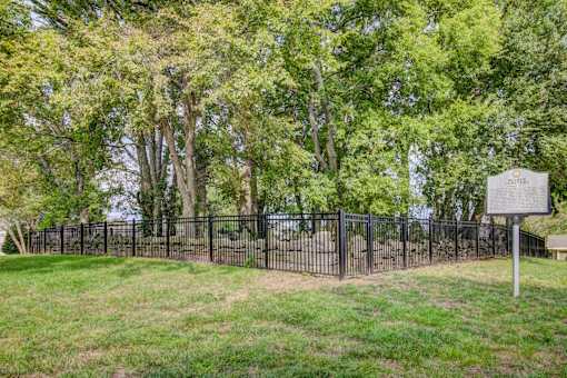 Historic cemetery with fencing and memorial marker at Wyndchase Aspen Grove Apartments, Tennessee, 37067