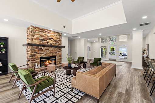 A living room with a fireplace and a couch.