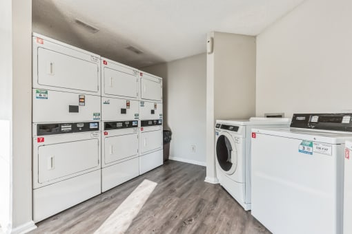 a washer and dryer in a laundry room with white appliances