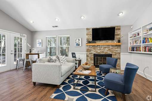 A living room with a fireplace and a couch.