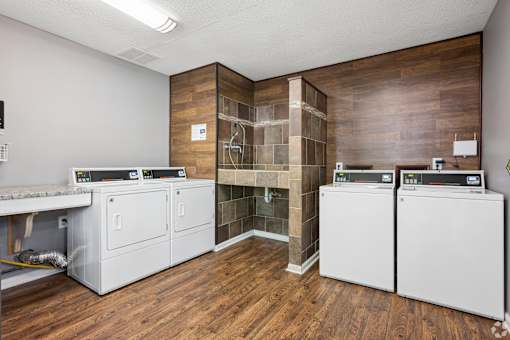 A laundry room with a washer and dryer in it.