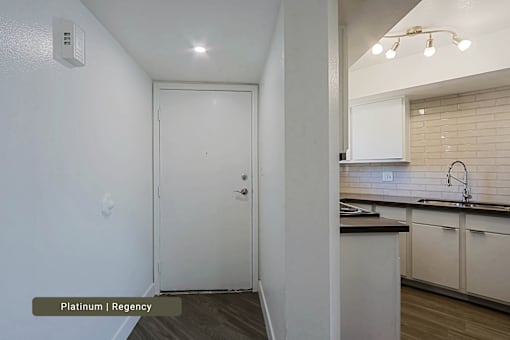 A white door in a room with a label that says Platinum | Regency.