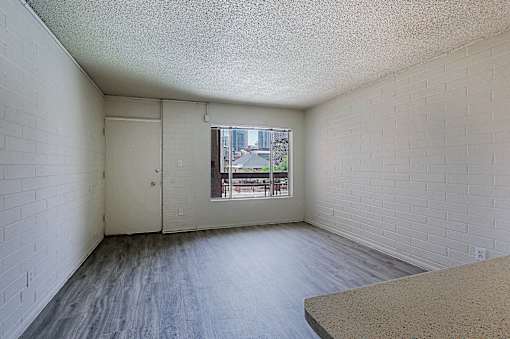 Room with Window and Wooden Floor at Ambassador West Apartments, Phoenix, AZ, 85003