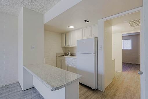Kitchen with White Refrigerator at Ambassador West Apartments, Phoenix, AZ, 85003