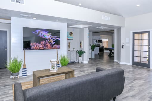 a living room with a couch and a tv at Tides at Mesa, Mesa