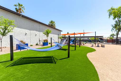 Playground with a blue hammock and a green hammock at Aspire West Phoenix, Arizona