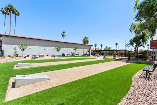 A park with a playground and a green lawn at Aspire West Phoenix, Arizona, 85031