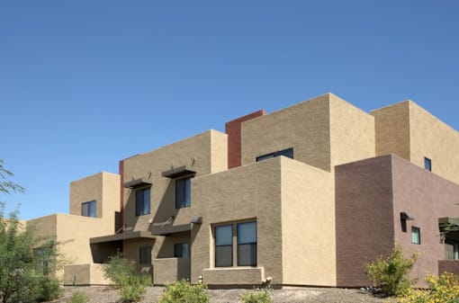 A modern house with a flat roof and large windows.