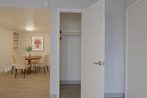 A room with a dining table and chairs at Connect on Northern, Glendale, AZ