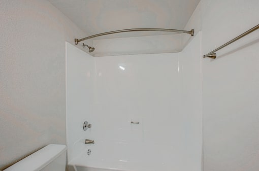 a bathroom with a shower and a tub