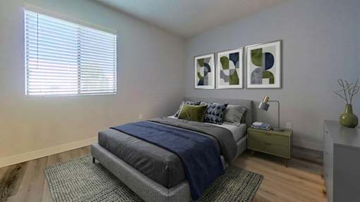 A bedroom with a bed, nightstand, and a window with blinds.