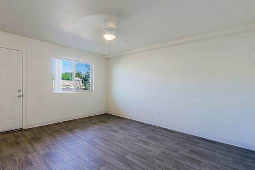 A room with a window and a door.